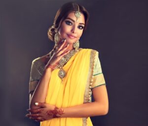 Girl wearing yellow color outfit for diwali